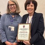 Carleen Vande Zande collecting an award